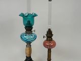 pair of antique glass candlesticks and a glass oil lamp