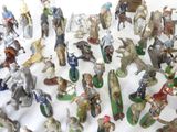 a lot of figurines that are sitting on a table