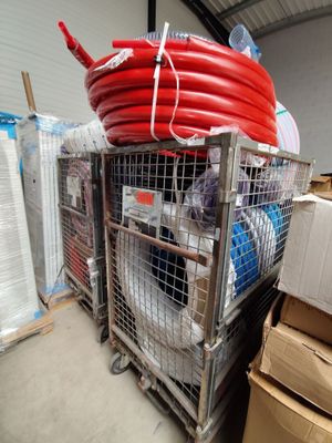 a metal cart with a bunch of hoses on top of it