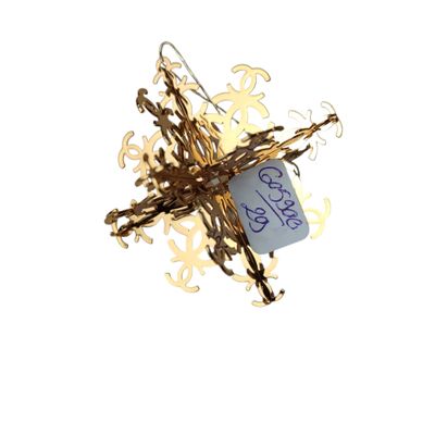 CHANEL Flocon de neige doré en métal