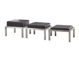 un ensemble de trois tabourets avec des assises en cuir noir sur fond blanc