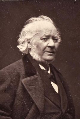 an old black and white photo of a man in a suit and tie