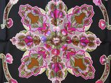 a close up of a square scarf with a floral design