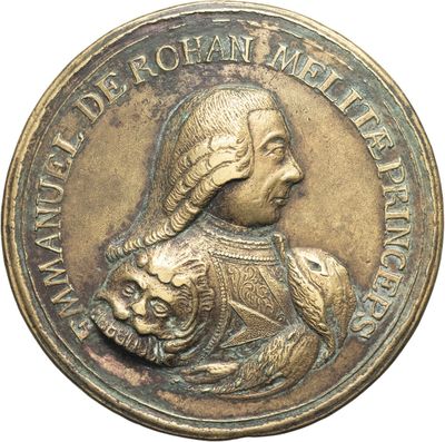 an image of a bronze medal with a woman holding a cat