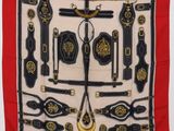 an image of a red scarf with black and gold decorations