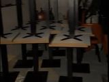 a picture of a room with tables and chairs in it