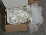 a box with a bunch of items in it on the floor
