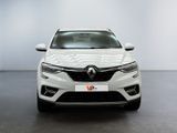 the front view of a white car in a showroom