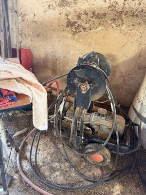 an image of a dirty room with a fan and other items