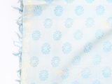 a close up of a blue and white blanket with a pattern on it