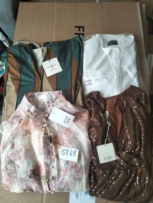 a lot of clothes that are sitting in a box