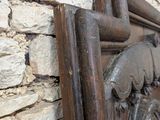 a close up of a wooden frame on a stone wall