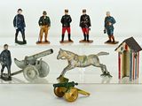 many figurines of men in military uniforms on display