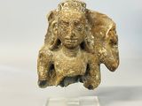 an image of a statue of a woman holding a baby in her arms