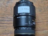a camera lens sitting on a wooden table