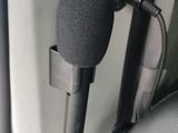 a microphone attached to the back of a car seat