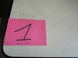 a pink sticker with the number one on it