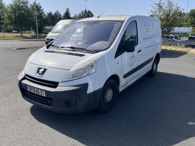 a white van that is parked in a parking lot