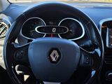 the interior of a car with a steering wheel and dashboard controls