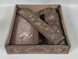 a wooden box with a bunch of wooden items inside of it