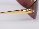 the sunglasses are made of gold and red plastic