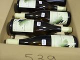 six bottles of wine in a cardboard box with a price tag