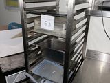 a metal rack with a tray of food inside of it