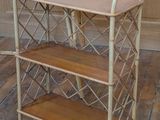 a wooden shelf with a basket on top of it