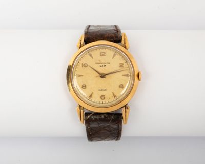 an image of a close up of a wrist watch on a white surface
