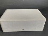 a white box sitting on top of a black table