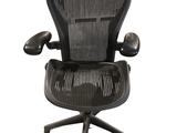an image of a black office chair with armrests on a white background