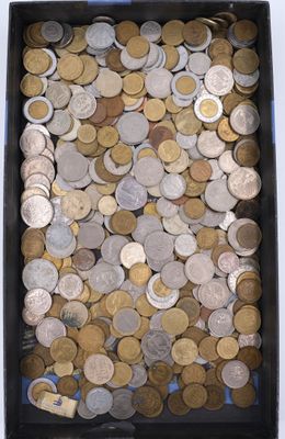 a box full of coins sitting on a table