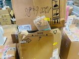 many boxes stacked on top of each other on the floor