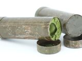 two metal containers with a green lid on a white surface
