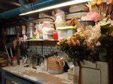 a bunch of flowers on the counter in the kitchen