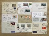 many different stamps on the envelopes on the table