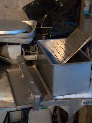 a toilet and a sink in a dirty room
