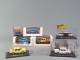 four different models of cars on display in a display case