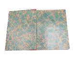 an open book with a green cover and gold lines on it