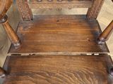 a wooden chair that is sitting on a hard wood floor