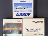 two boxed boxes of air france and a model airplane on a table
