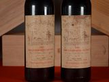 two bottles of wine sitting next to each other on a table