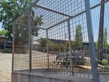 a truck with a cage on the back of it