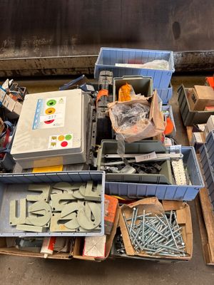 a pile of assorted items sitting on the ground