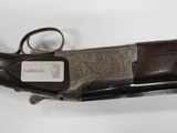 an old gun with a tag on it sitting on a table