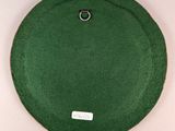 an image of a green hat on a white surface
