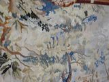 a painting on the wall of a room with a painting of a giraffe