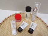 three different types of skin care products sitting on a tray
