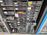 many bins of assorted metal items in a store