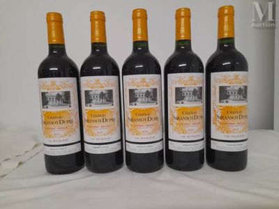 six bottles of wine are lined up on a table